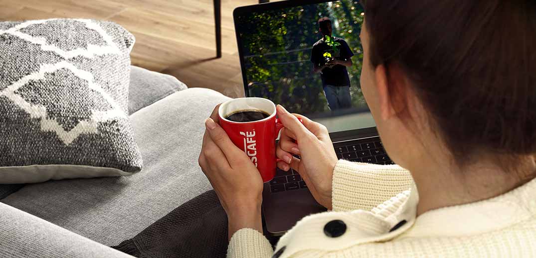 nescafe-cup-wide drinking coffee